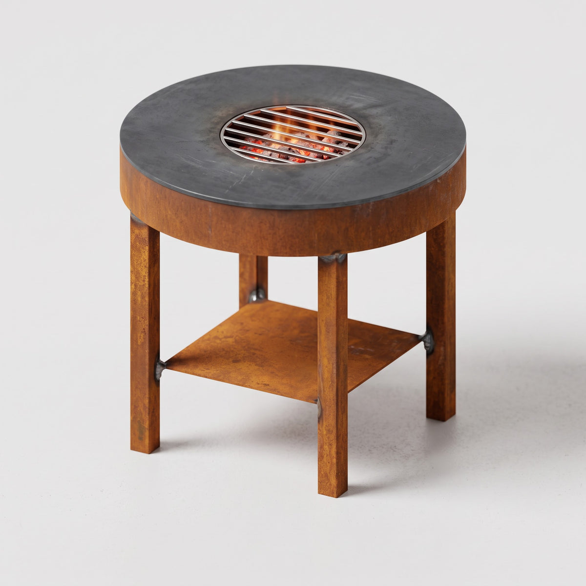 Plancha de 10 mm de un brasero barbacoa corten con parrilla central inoxidable
